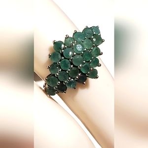 Emerald cluster ring.